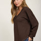 RAW EDGE V-NECK LONG SLEEVE TEXTURED KNIT TOP