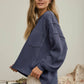 SPLIT NECK RAW EDGE LONG SLEEVE RIBBED KNIT TOP