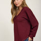 RAW EDGE V-NECK LONG SLEEVE TEXTURED KNIT TOP