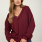 RAW EDGE V-NECK LONG SLEEVE TEXTURED KNIT TOP