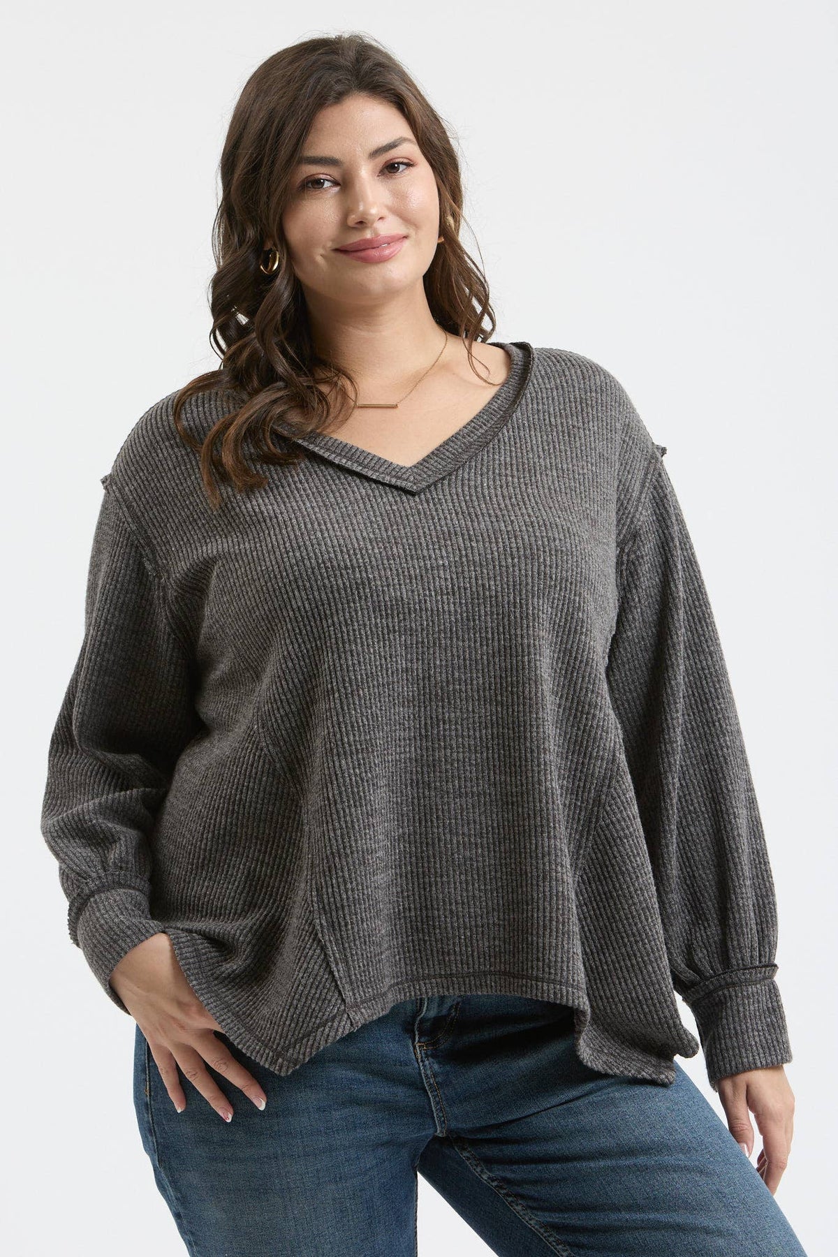 PLUS V NECK ASYMMETRICAL HEM LONG SLEEVE KNIT TOP