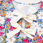 Floral Bow Tie Sleeveless Peplum Blouse